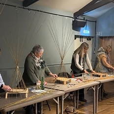 Participant weaving a willow angel during a Christmas craft workshop in Bedfordshire