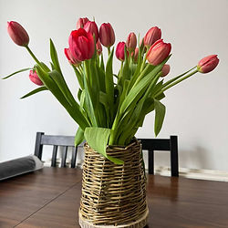 Fresh seasonal flowers arranged in a handmade willow vase as part of a two-in-one craft workshop