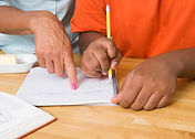 child working with teacher
