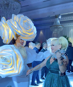 Elena playing a violin while her and a model dance to the music at a luxury wedding in Toronto at The Royalton