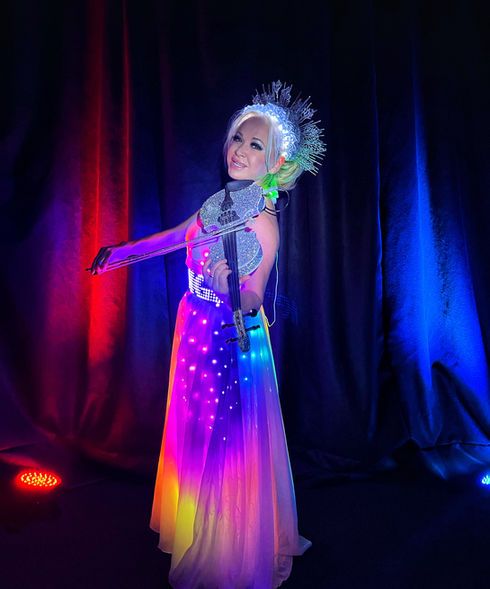 Elena showcasing her colorful LED gown. Available for corporate events in Toronto. As well as parties and other celebrations too 