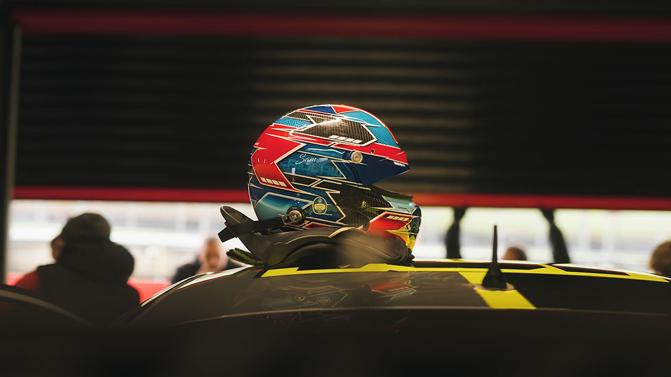 High angle view of a drone capturing a race car speeding on a circuit