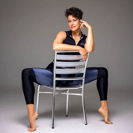 Fitness trainer sitting on a chair.