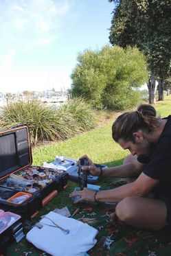 Drilling gemstones by hand in nature - outdoor jewellery crafting in Australia.