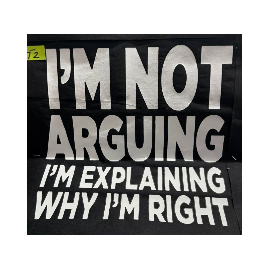Black Tee with bold white text that reads “I’m Not Arguing, I’m Explaining Why I’m Right”