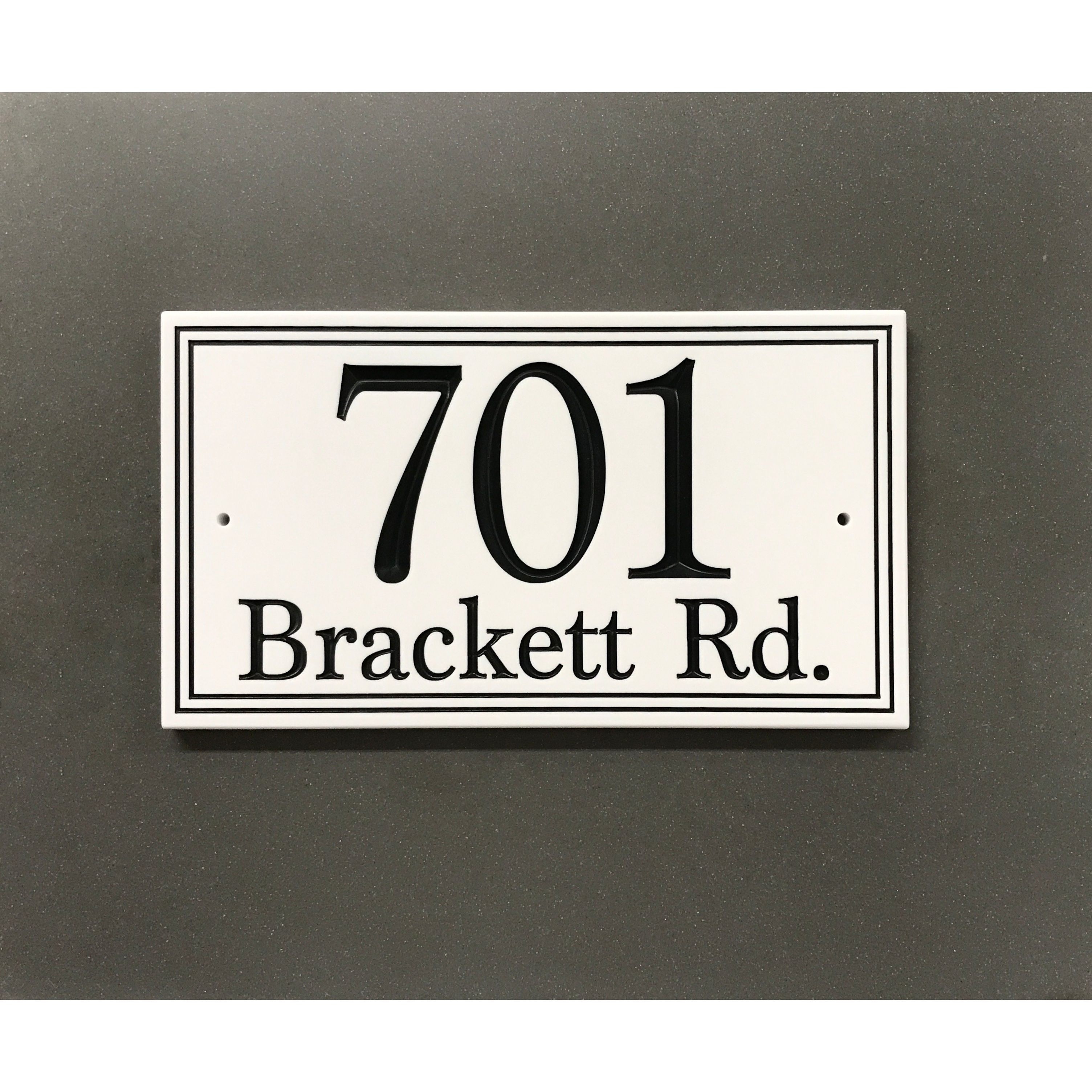 Simplicity address plaque featuring V-carved house numbers on a weatherproof, stone-look solid surface material.