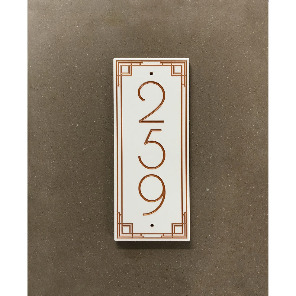 Vertical Beelman address plaque featuring V-carved house numbers on a weatherproof, stone-look solid surface material.