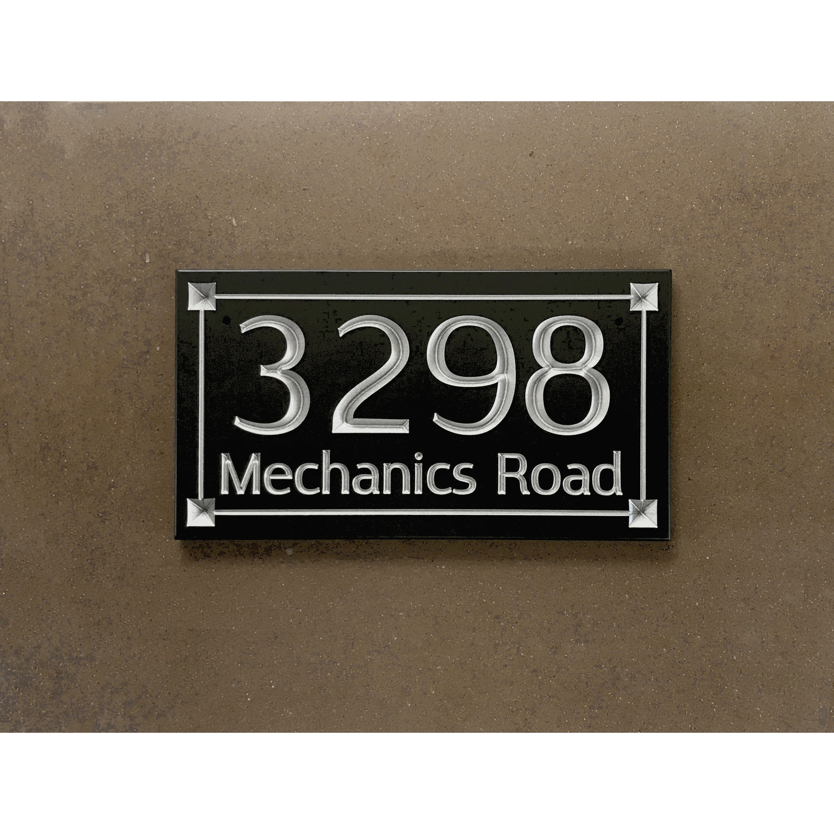 Industrial address plaque featuring V-carved house numbers on a weatherproof, stone-look solid surface material.