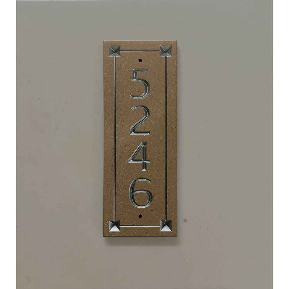 Vertical industrial address plaque featuring V-carved house numbers on a weatherproof, stone-look solid surface material.