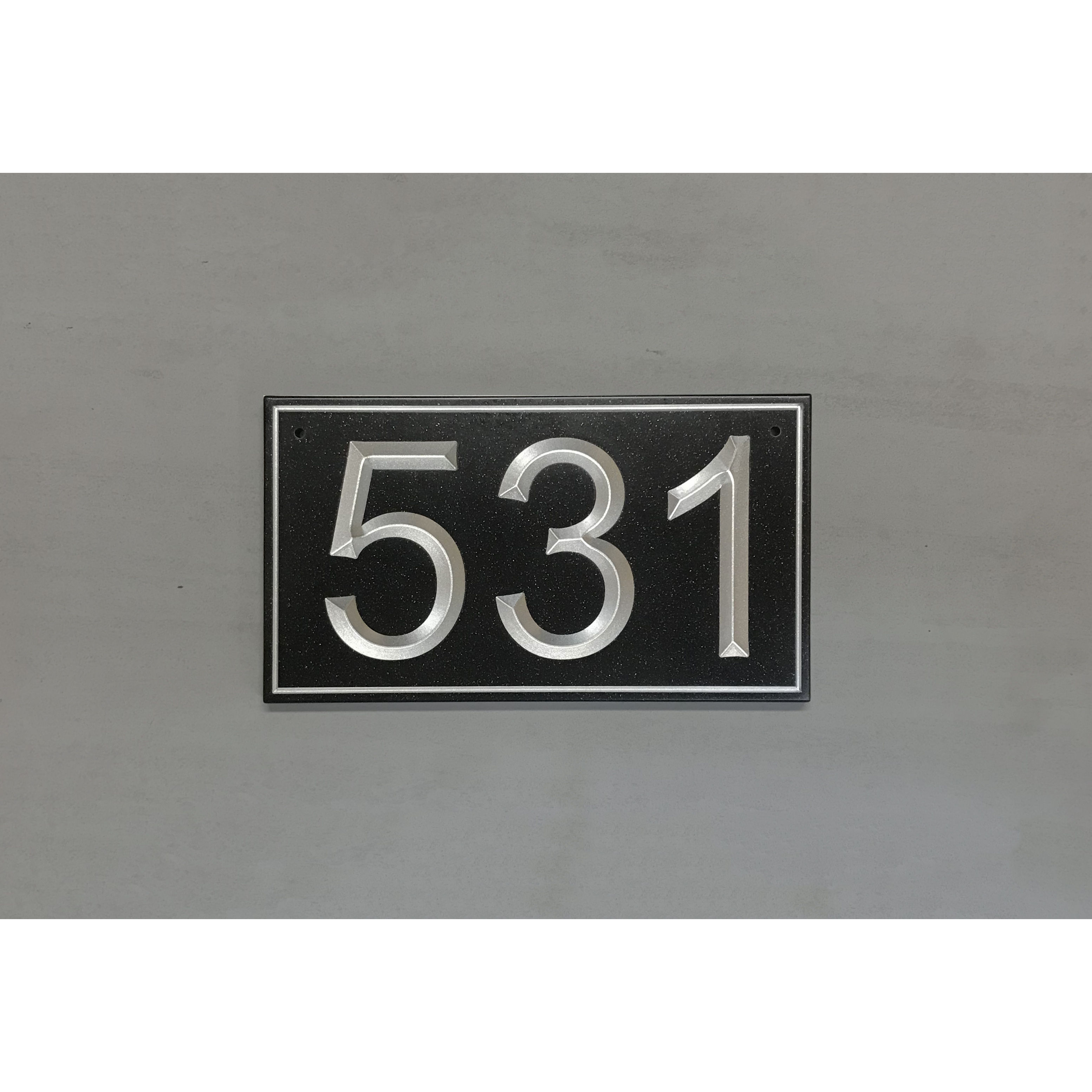 Classic address plaque featuring V-carved house numbers on a weatherproof, stone-look solid surface material.