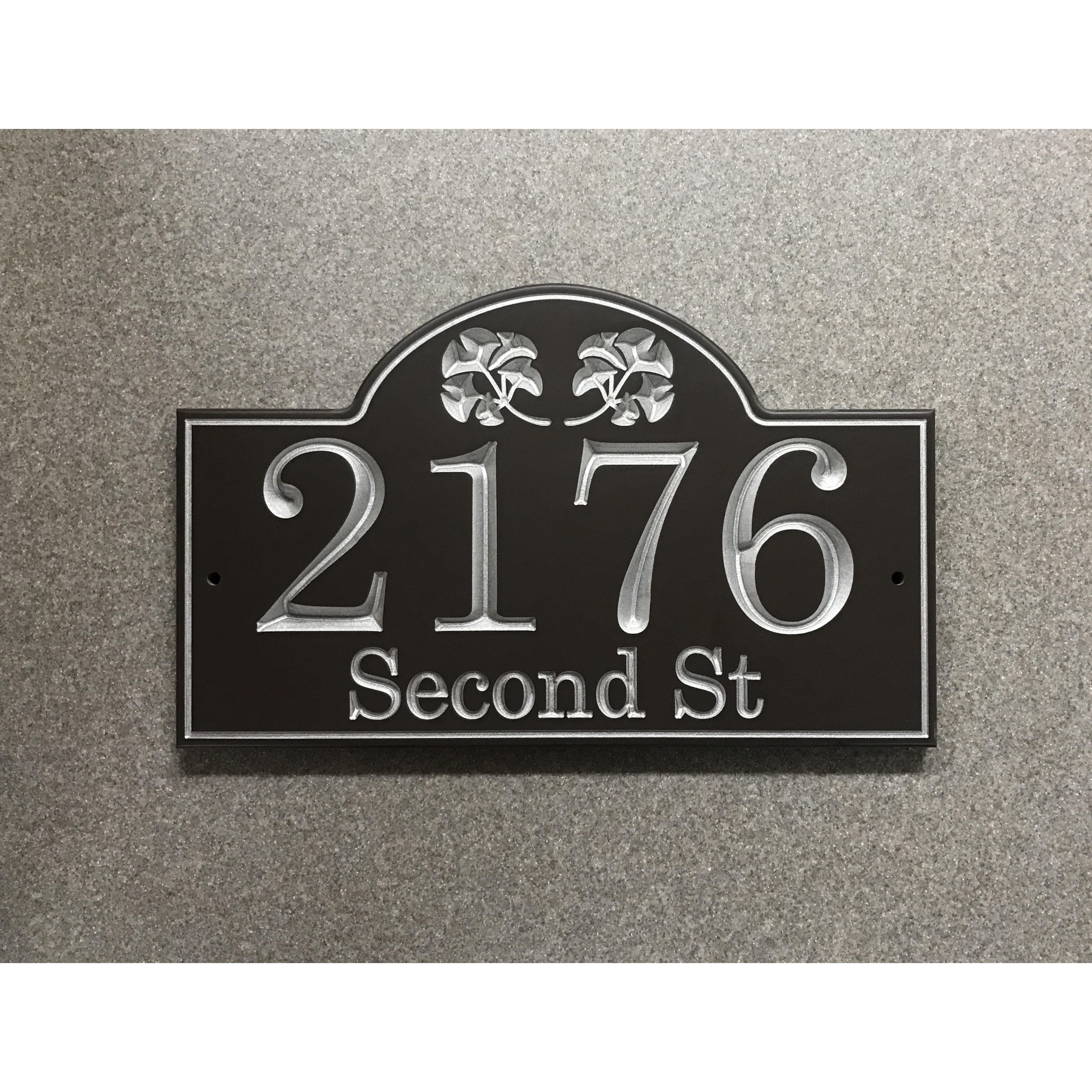 Ginkgo address plaque featuring V-carved house numbers on a weatherproof, stone-look solid surface material.