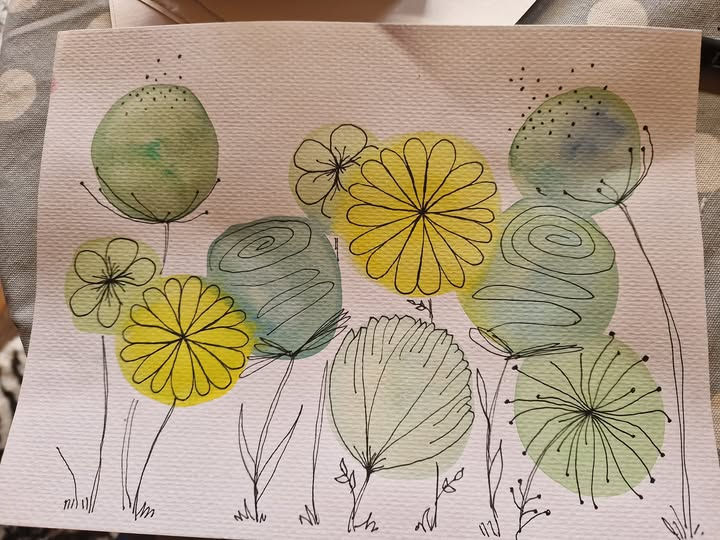 A simple water painting by me, various flowers, squiggly black doodling, all blooming and healthy. A visual representation of how we all deserve to bloom.