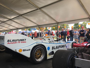 People around Le Mans cars.jpeg