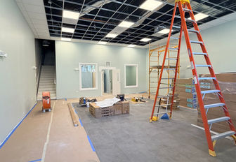 Commercial build-out in Chicago with acoustic ceiling tile, painted walls, and new flooring