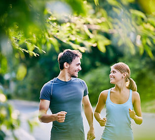 Image of young white couple jogging