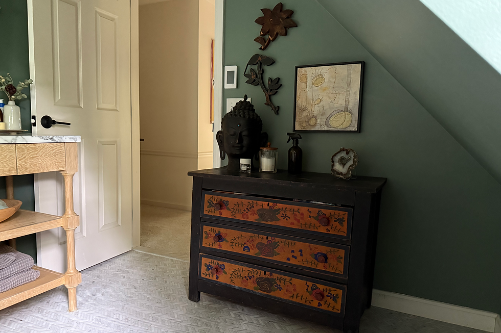 After the toilet is replaced by an antique painted dresser for storage
