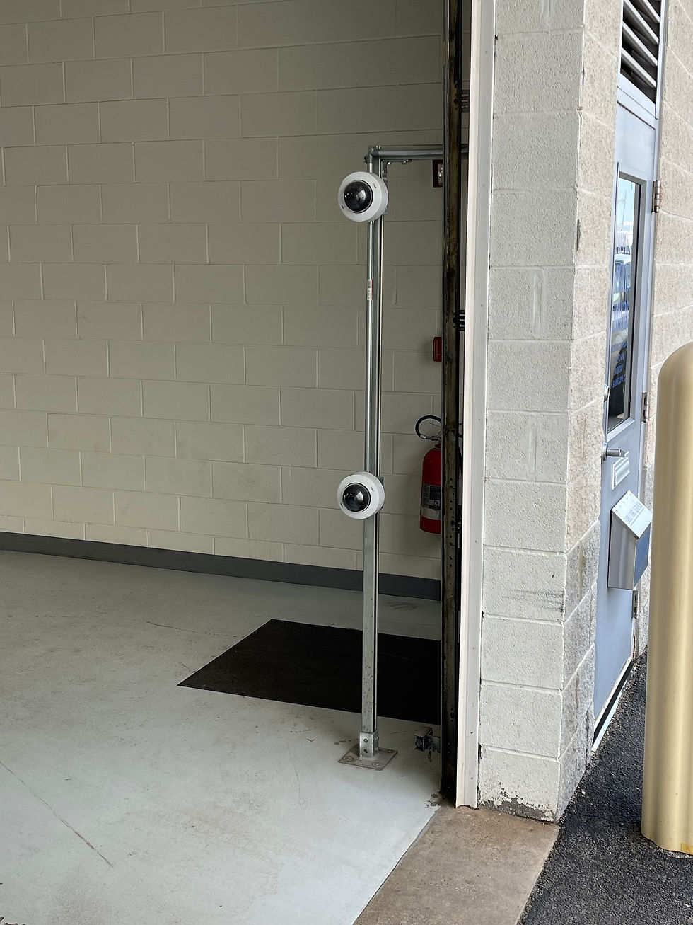 Axis security camera mounted on a pole.
