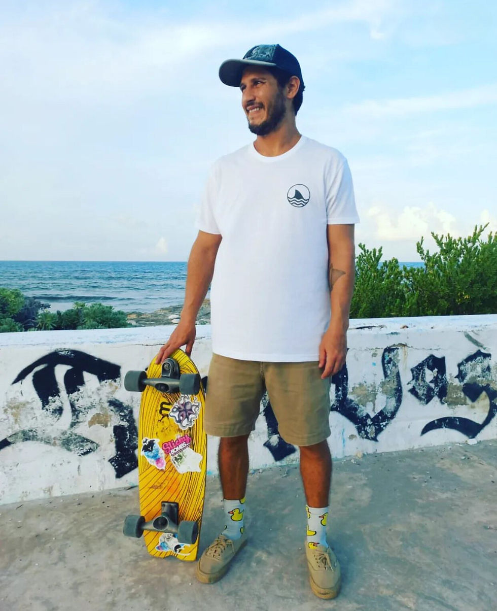 merida and isla mujeres local artist Chubby Galan with skateboard