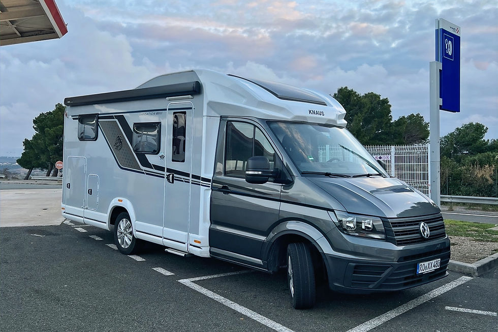 Knaus Van Wave Vansation 640 MEG campervan parked at a highway gas station in France, highlighting the rising fuel costs for road trips in Europe.