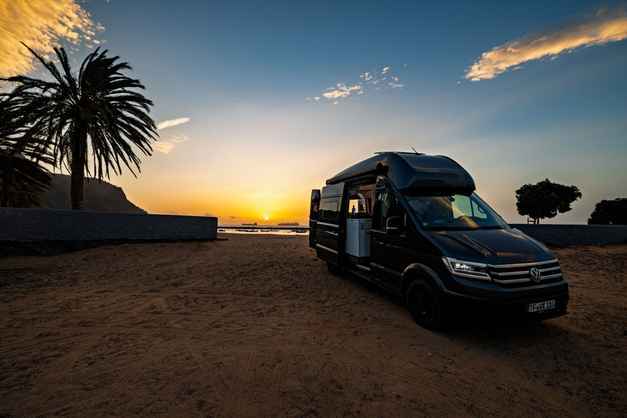 Volkswagen Grand California 600 with solar campervan parked at sunset in Tenerife.