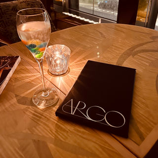 Cocktail glass and candle on a table at Argo, one of the world’s 50 best bars in Hong Kong.