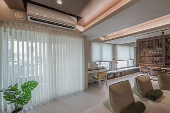 Living room patio door with light-filtering vertical blinds.