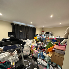 Messy playroom with stuff all over the floor