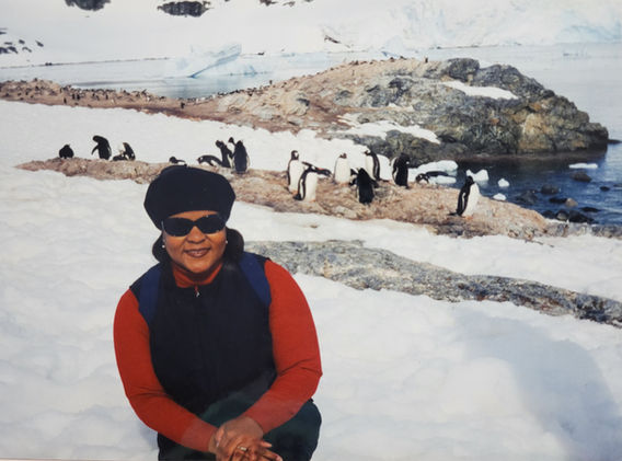 Website Photo -- Kalin with penguins in Antarctica.jpg