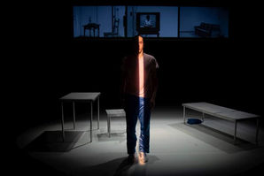 Body, dance performer standing in the center of theater scenography