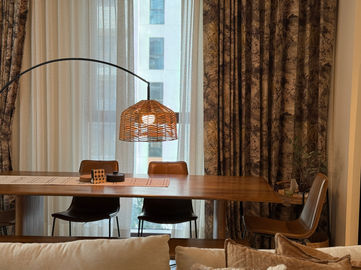 Neutral-toned family living space with woven textures and calm composition.