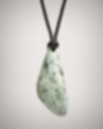 Front view of white nephrite jade drop pendant with light blue-green marbling on black braided cord.