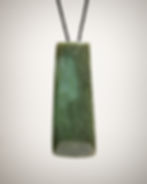 Blue-green nephrite jade adze pendant, back view on black braided cord, flat back with soft polish and natural internal layer