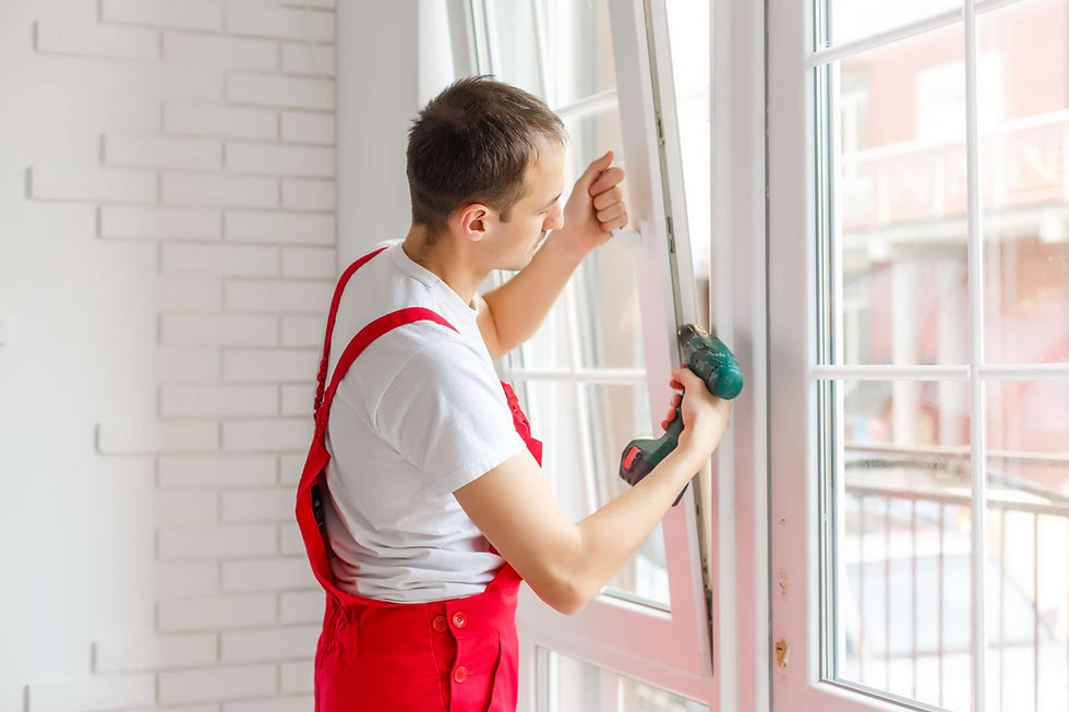 man fixing drafty windows