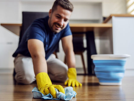 man cleaning laminate floors