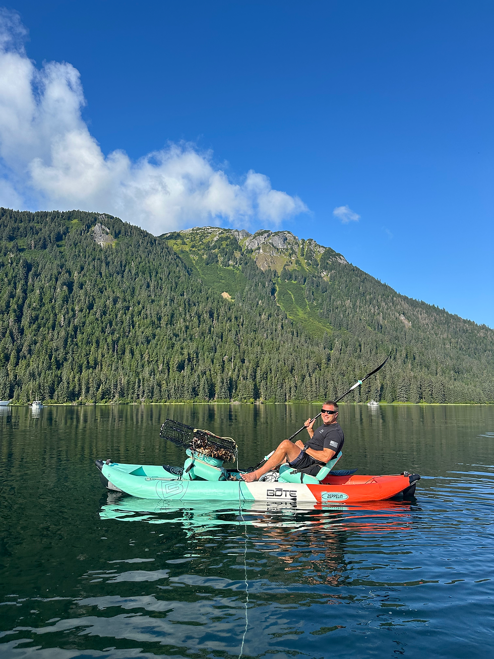 Guest kayaking near Blackwood with a crab pot, surrounded by beautiful scenic views of calm waters and lush natural landscape