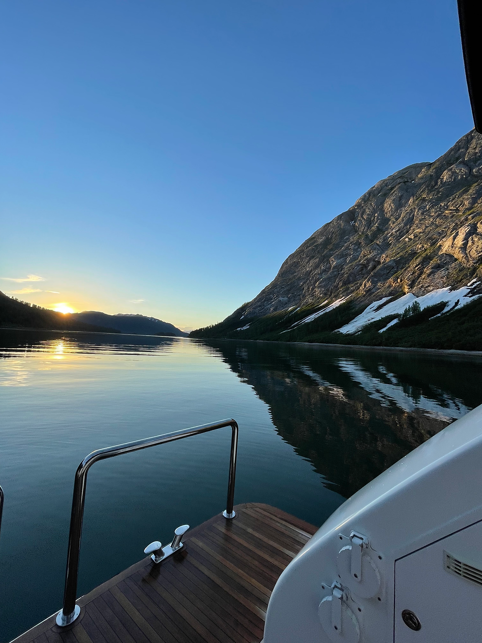 View from Blackwood’s back deck overlooking pristine Alaskan nature with calm waters and breathtaking wilderness scenery
