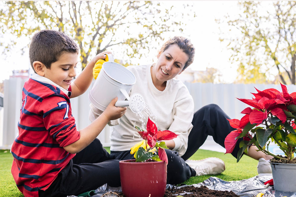 Child Watering Plant with Mom