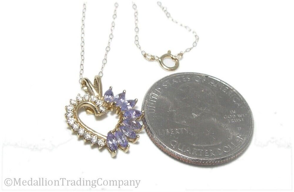 Thumbnail: 14k  yellow gold .54 carat tanzanite diamond heart pendant cable chain necklace