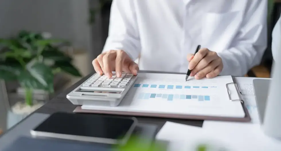 Person calculating the true cost of turnover in business