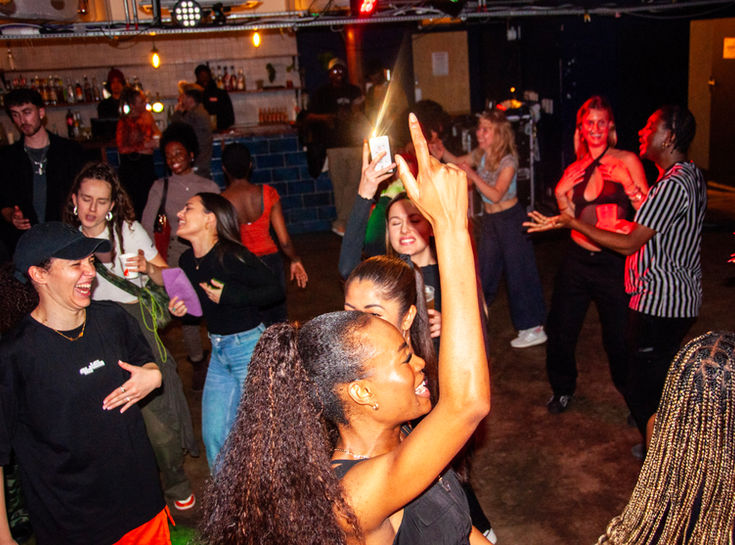 Energetic dance moment with participants of various backgrounds enjoying movement.