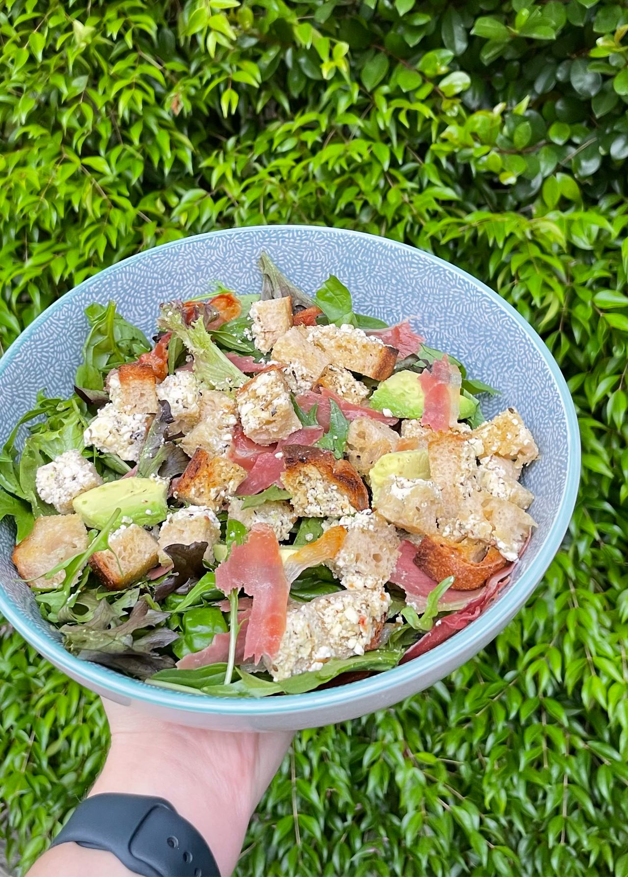 lagom bakery sourdough, avocado and prosciutto salad.