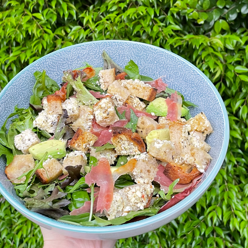lagom bakery sourdough, avocado and prosciutto salad.