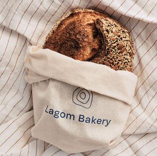 seedy sourdough loaf in lagom bakery bread bag