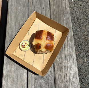 Hot cross bun with Pepe Saya butter in the sun.