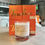 Thumbnail: Cashmere Lotion Candle with orange boxes