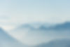 beautiful-shot-high-white-hilltops-mountains-covered-fog.jpeg