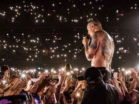 Chester Bennington Singing One More Light surrounded by fans holding lighters