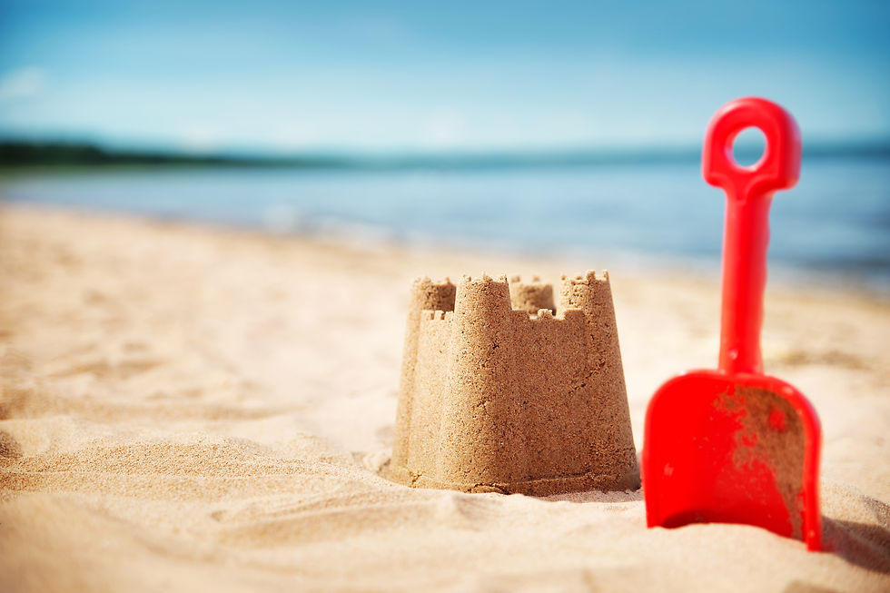 Sandcastle and shovel