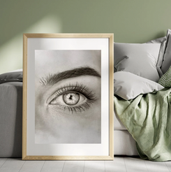 Painting of an eye in a golden frame, above a green bed, Wallyaa.