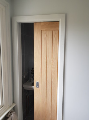 New partiton wall with oak pocket door
